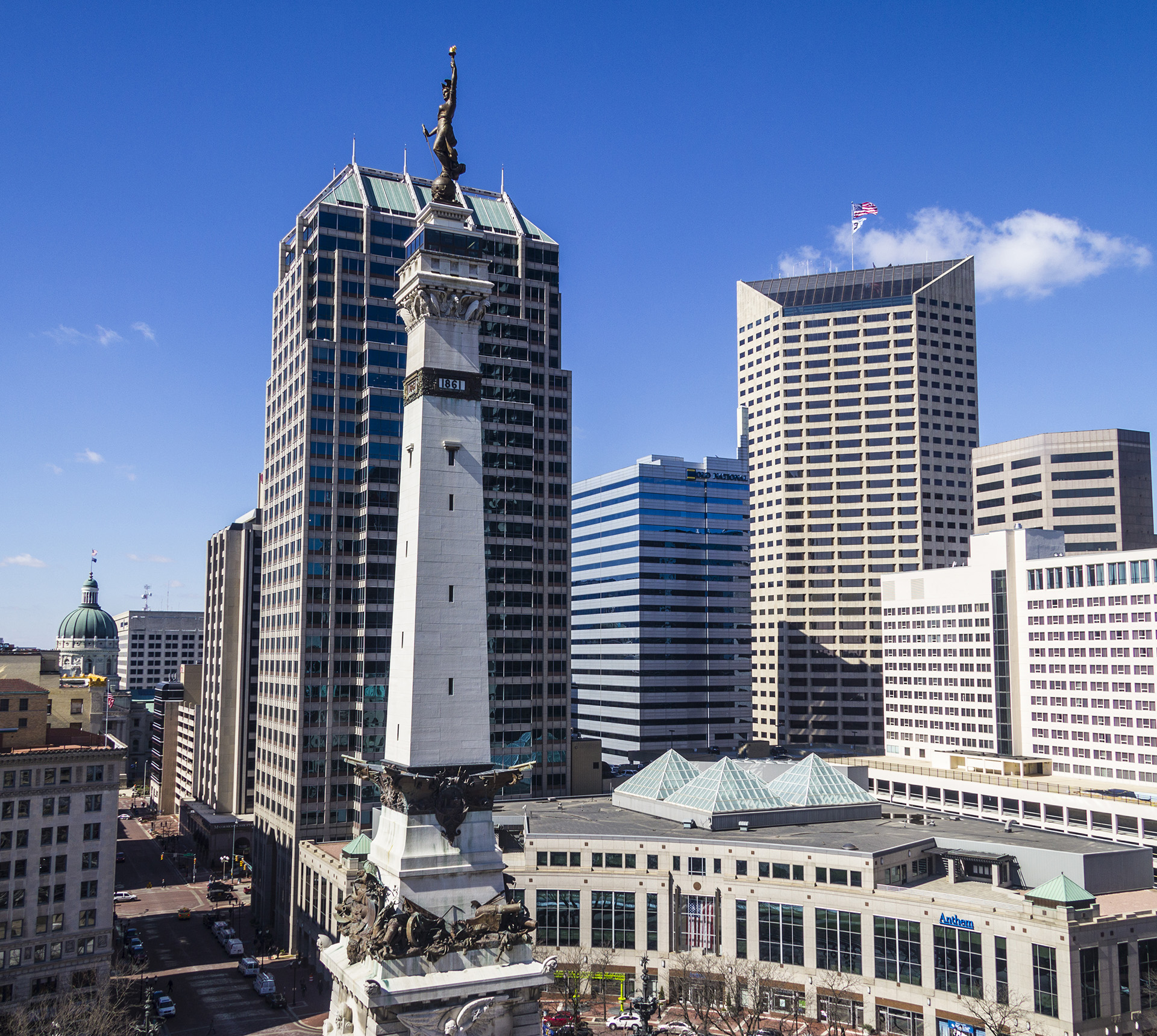 A view of downtown Indianapolis with a blue sky